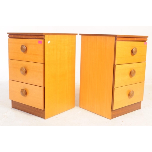 585 - A vintage 1980's faux teak wood dressing table and matching bedside cabinets. The dressing table hav... 