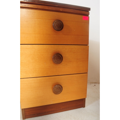 585 - A vintage 1980's faux teak wood dressing table and matching bedside cabinets. The dressing table hav... 