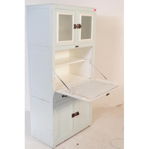 597 - A retro mid 20th century circa 1950s kitchen unit cabinet. The cabinet having twin glazed doors over... 