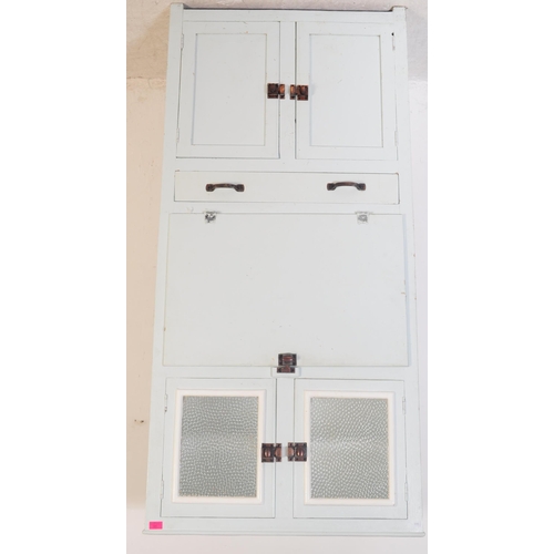 597 - A retro mid 20th century circa 1950s kitchen unit cabinet. The cabinet having twin glazed doors over... 