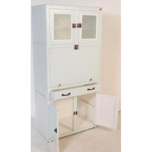 597 - A retro mid 20th century circa 1950s kitchen unit cabinet. The cabinet having twin glazed doors over... 