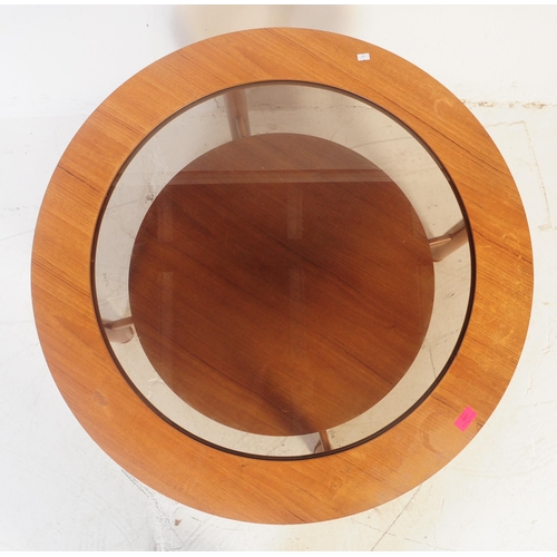 608 - British Modern Design - A retro 20th century circular glazed coffee table. The table having smoked g... 