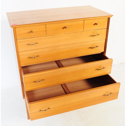 611 - Alfred Cox - Retro mid 20th century teak veneered chest of drawers. Having a rectangular flared top ... 