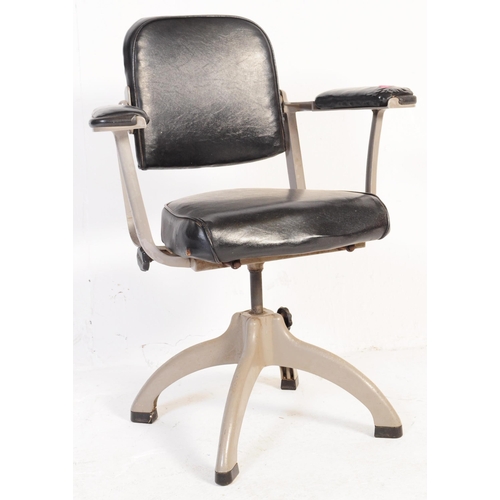 628 - Tan Sad - A mid 20th century industrial Tan Sad metal and black leatherette swivel office chair. The... 