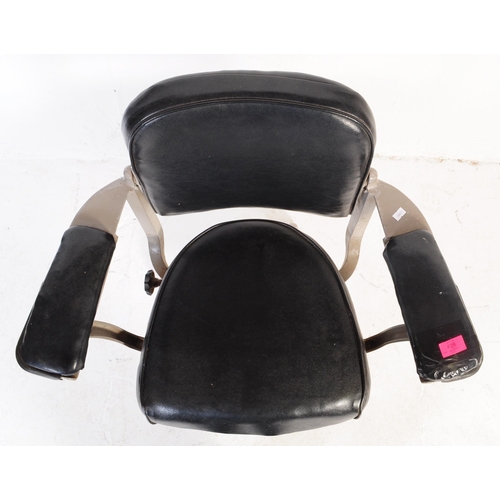 628 - Tan Sad - A mid 20th century industrial Tan Sad metal and black leatherette swivel office chair. The... 