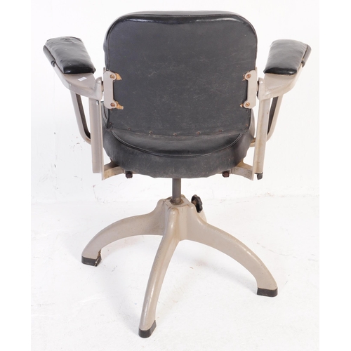 628 - Tan Sad - A mid 20th century industrial Tan Sad metal and black leatherette swivel office chair. The... 