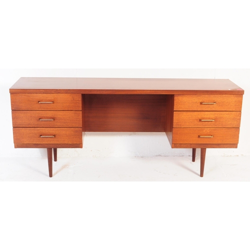 637 - Austinsuite - A retro mid 20th century Austinsuite teak desk. The desk having central kneehole flank... 
