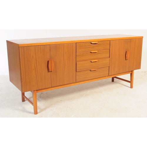 639 - British Modern Design - A retro mid 20th century circa 1960s teak veneer sideboard. The sideboard ha... 