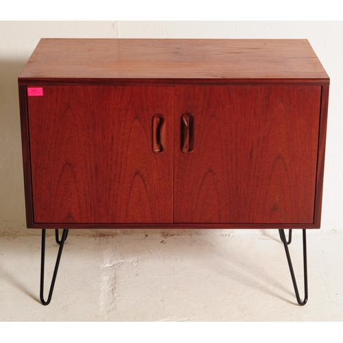 646 - G Plan - A mid 20th century retro circa 1960s G-Plan teak cabinet having twin doors raised over blac... 