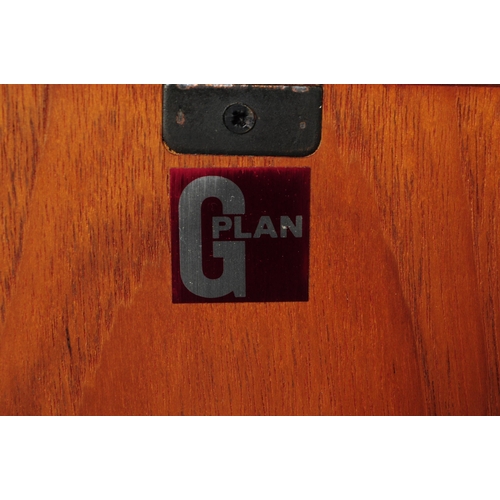 646 - G Plan - A mid 20th century retro circa 1960s G-Plan teak cabinet having twin doors raised over blac... 