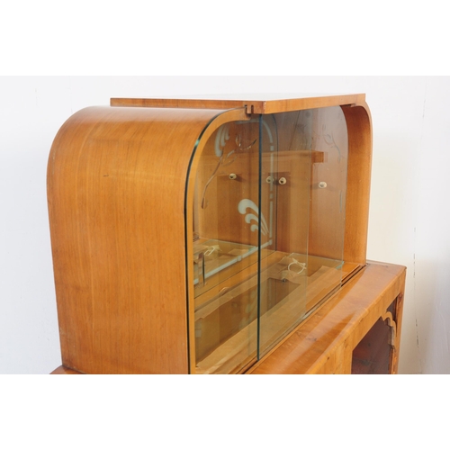 647 - A 20th century 1930's Art Deco walnut China display cabinet. The cabinet, of walnut construction hav... 