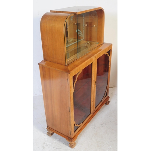 647 - A 20th century 1930's Art Deco walnut China display cabinet. The cabinet, of walnut construction hav... 