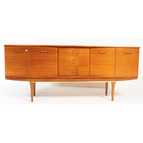 650 - Stonehill Furniture - A retro 20th century teak sideboard credenza. Of rectangular form with a bank ... 