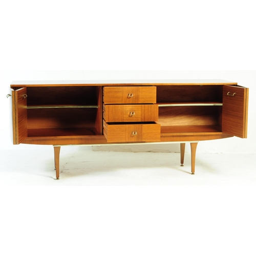 650 - Stonehill Furniture - A retro 20th century teak sideboard credenza. Of rectangular form with a bank ... 