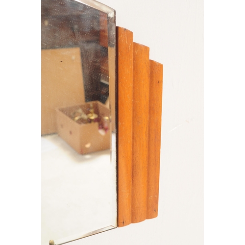 652 - A retro mid 20th century 1950s Art Deco style hanging wall bevelled edge mirror, together with a cir... 