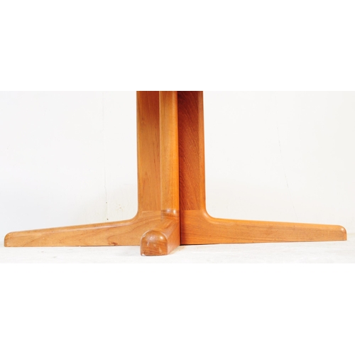 654 - Mid-century Danish manner teak wood circular dining table. Raised on splayed legs with extending act... 