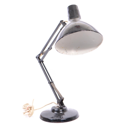 655 - A retro Norwegian black angle poise lamp stamped to frame with maker and retailer. Together with a v... 