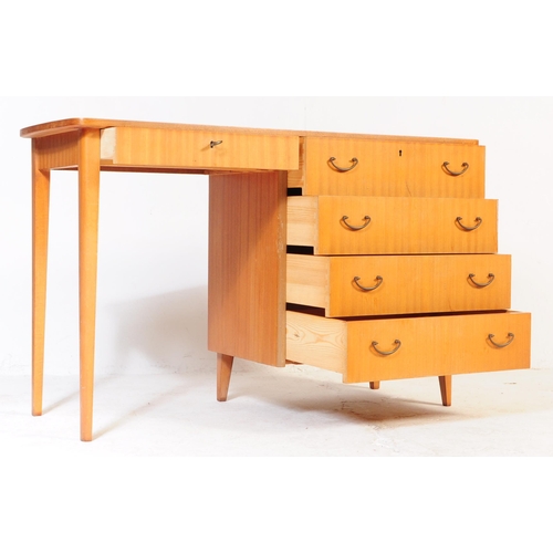 662 - A mid-century, circa 1970’s teak wood pedestal desk with open kneehole flanked by bank of drawers.  ... 