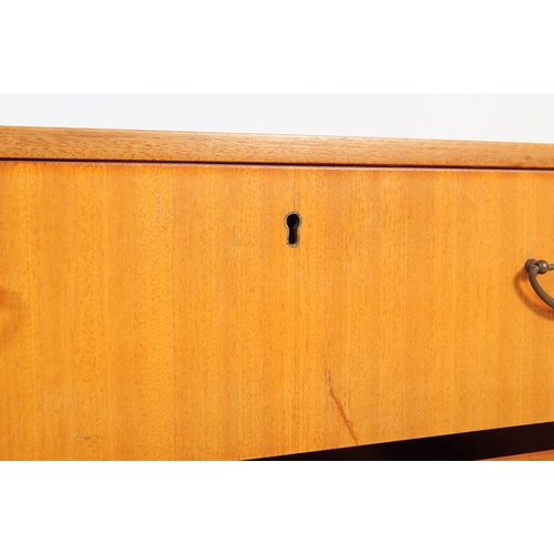 662 - A mid-century, circa 1970’s teak wood pedestal desk with open kneehole flanked by bank of drawers.  ... 