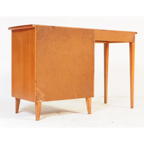 662 - A mid-century, circa 1970’s teak wood pedestal desk with open kneehole flanked by bank of drawers.  ... 