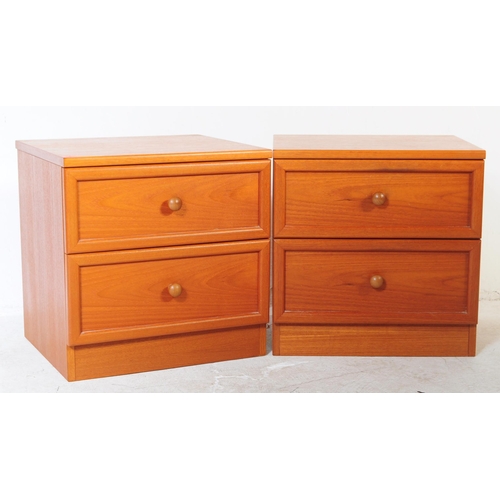 664 - G Plan - A pair of retro mid 20th century G-Plan teak bedside cabinets. Each having twin drawers ove... 