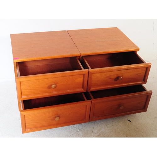 664 - G Plan - A pair of retro mid 20th century G-Plan teak bedside cabinets. Each having twin drawers ove... 