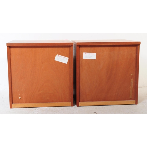 664 - G Plan - A pair of retro mid 20th century G-Plan teak bedside cabinets. Each having twin drawers ove... 