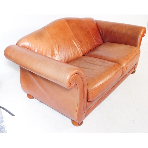 667 - A good contemporary Chesterfield / club  leather sofa settee. Raised on bun feet with arched barrel ... 
