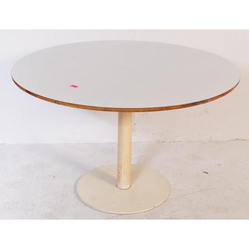 672 - A vintage mid century round dining table with flat base in the manner of Arkana. With formica top, i... 