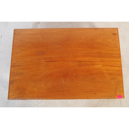 673 - A mid century large teak wood coffee table. Raised on square tapering with fitted frieze under a lar... 