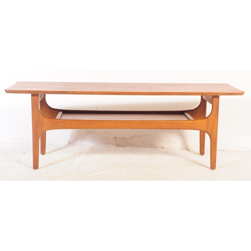 678 - British Modern Design - A retro mid 20th century teak coffee table having rectangular top over under... 