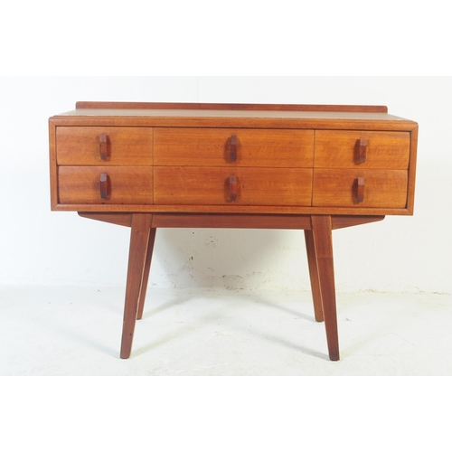 689 - Heals - A mid 20th century circa 1970s teak Heals sideboard / low chest of drawers. Three banks of t... 