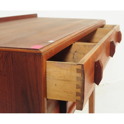 689 - Heals - A mid 20th century circa 1970s teak Heals sideboard / low chest of drawers. Three banks of t... 