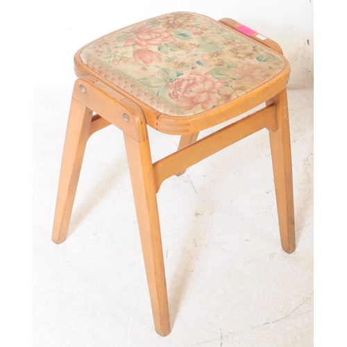 695 - British Modern Design - A set of four retro mid century teak stacking stool, each upholstered with a... 