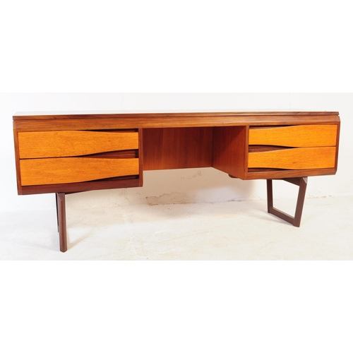 697 - White & Newton - A mid 20th century teak White & Newton desk / dressing table. The desk having knee ... 