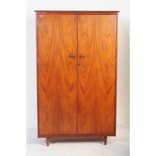 698 - Butilux - A retro mid 20th century teak Butilux double wardrobe. The wardrobe having twin doors, eac... 