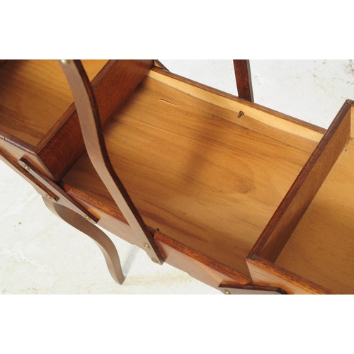 715 - A 1950's metamorphic / concertina sewing box on legs.  This dark teak unit has a carry handle to top... 
