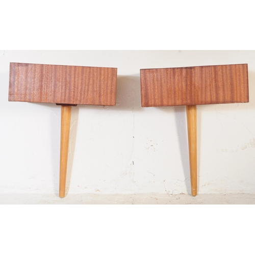 716 - A pair of mid century teak wood wall mounted & free standing bedside tables. Each raised on single t... 