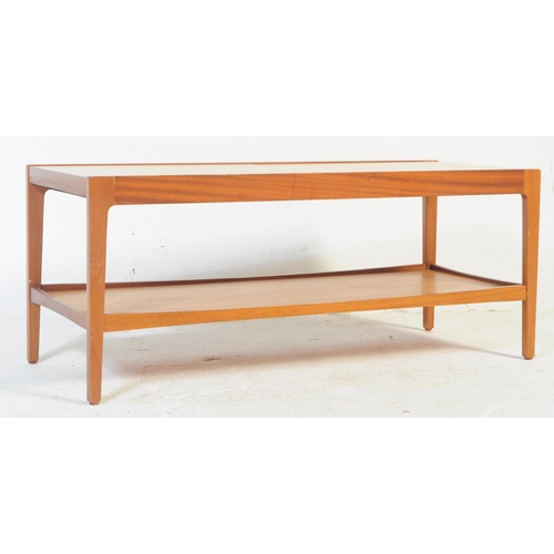 719 - Remploy Furniture - A mid-century teak rectangular coffee table by Remploy. With sliding top to reve... 