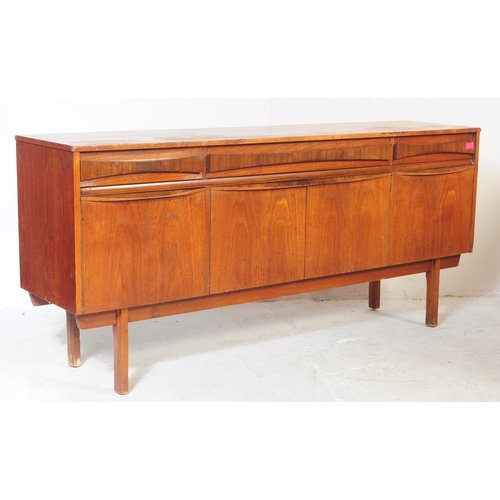 722 - A retro 1960 / 1970's teak sideboard credenza. Of rectangular form with twin doors to centre and fla... 
