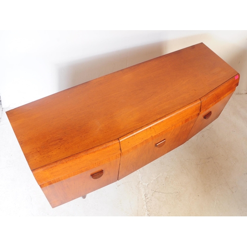725 - EoN - Elliots of Newbury - A retro 1950 / 1960's teak wood bow fronted sideboard credenza having sha... 