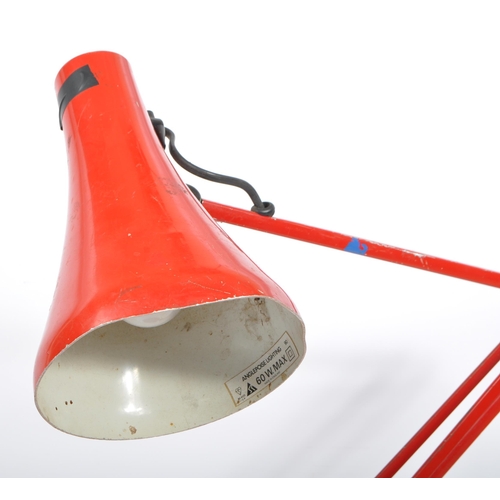 732 - A mid 20th Century Anglepoise desk lamp in red colourway. The lamp with a rotating stem and shade, a... 