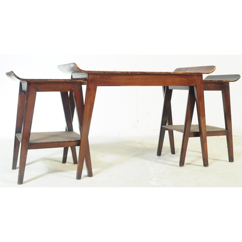 734 - A vintage mid 20th century ply wood ski top nest / occasional / coffee tables. Having one larger one... 