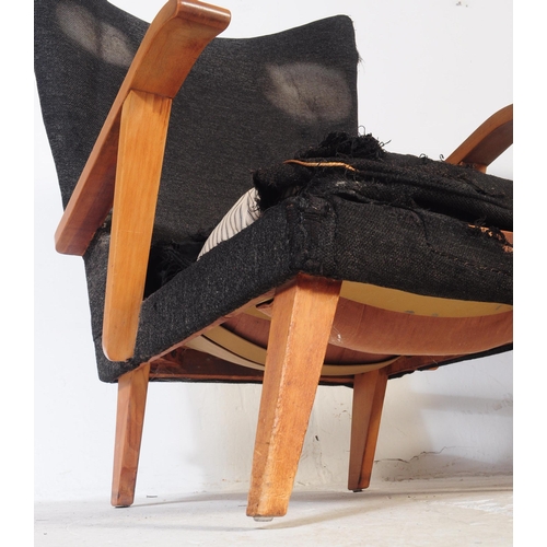 738 - British Modern Design -  A pair of vintage 20th century batwing style sitting lounge armchairs.  The... 