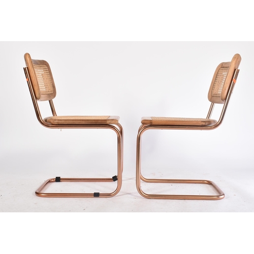 744 - A set of eight retro 20th century oak & chrome cantilever chairs. Each chair having oak seat frame a... 