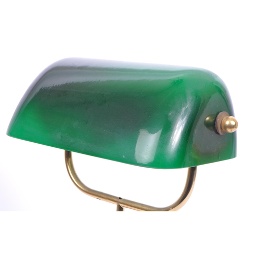 745 - A vintage 20th century bankers office table lamp light. Having a green glass swinging shade, with br... 