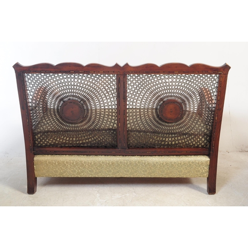 766 - An early 20th century mahogany and cane begere suite comp[rising of small proportioned two seater so... 