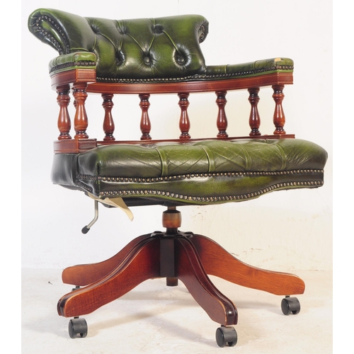 799 - A  Chesterfield style green leather captain's office swivel desk armchair. The chair having button b... 