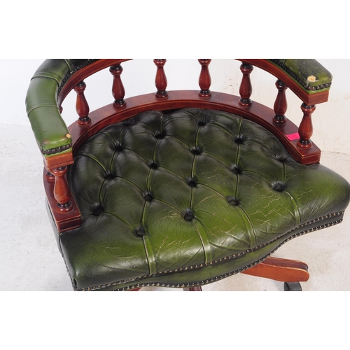 799 - A  Chesterfield style green leather captain's office swivel desk armchair. The chair having button b... 