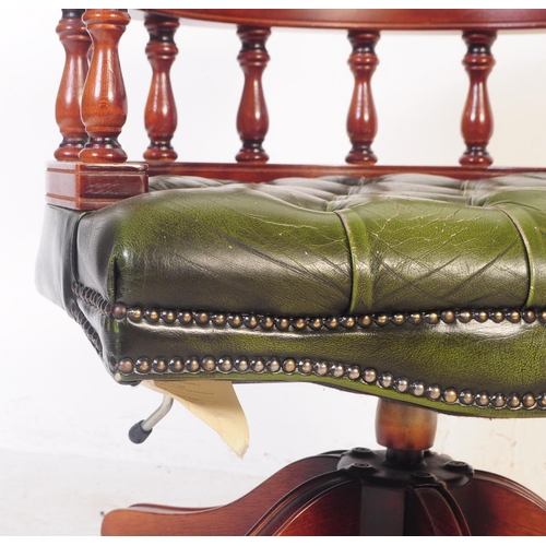 799 - A  Chesterfield style green leather captain's office swivel desk armchair. The chair having button b... 